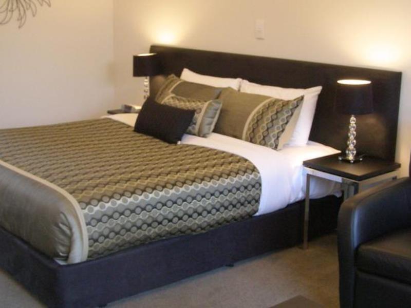 Bellano Motel Suites Christchurch Exterior foto A bed